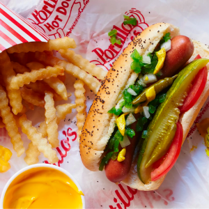 Portillo's is the go-to for iconic Chicago-style hot dogs and delicious Italian beef sandwiches, offering hearty comfort food in a fun, casual atmosphere for an authentic Chicago experience.