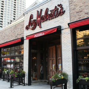 Lou Malnati’s offers the essential Chicago experience with its famous deep-dish pizza in a casual, family-friendly setting, ideal for relaxing after market research activities.