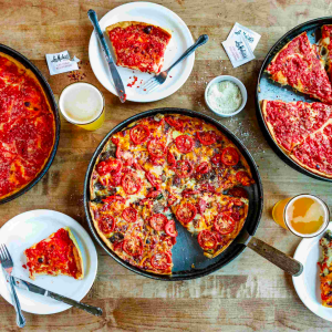 Lou Malnati's provides an essential Chicago deep-dish pizza adventure, available citywide. Its relaxed, family-oriented setting is perfect for team meals post-market research activities.